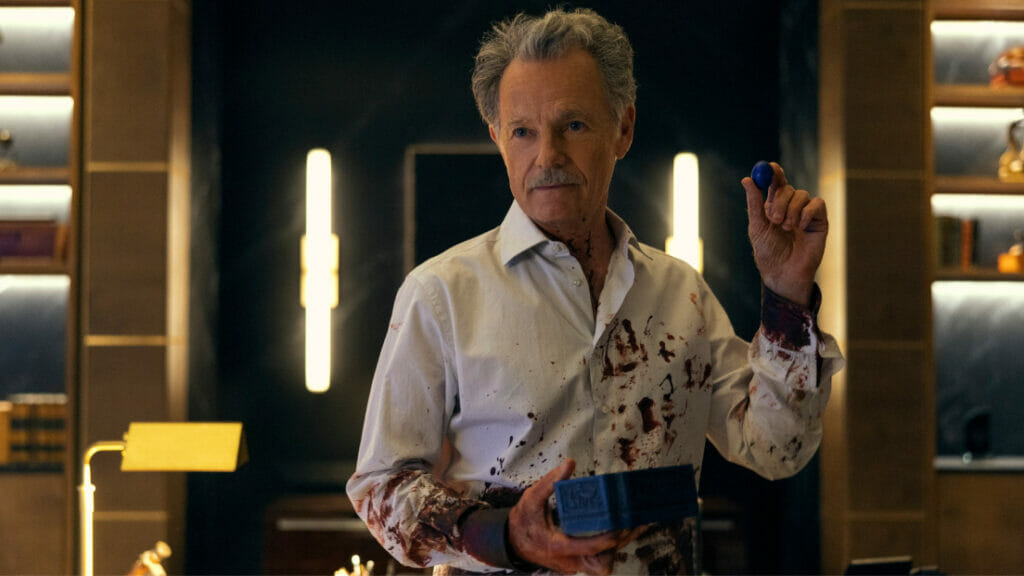 Bruce Greenwood stars as pharmaceutical CEO Roderick Usher wearing a shirt covered in blood in the Netflix original horror series THE FALL OF THE HOUSE OF USHER.