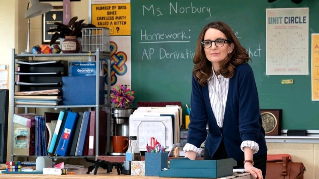 Tina Fey reprises her role as calculus teacher Ms. Norbury in her classroom in the 2024 movie musical adaptation of MEAN GIRLS. 