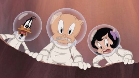 Daffy Duck, Porky Pig, and Petunia Pig all look horrified and scared together while wearing space suits in the feature-length animated film THE DAY THE EARTH BLEW UP: A LOONEY TUNES MOVIE.