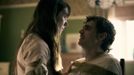 ‘Together’ Review – Body Horror is the Best Couples Therapy Alison Brie sits over Dave Franco as he's strapped to a chair in duct tape while they both look scared for their lives in the body horror movie TOGETHER.