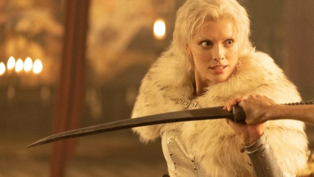 Actress Wallis Day stuns as the villainous Dark Annisia holding off a blade from attacking her during an intense action scene in the 2025 RED SONJA reboot. 