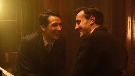 ‘The History of Sound’ Review – Paul Mescal and Josh O’Connor Shine in Quiet Period Romance Josh O'Connor and Paul Mescal share laughter and big smiles as they lean over towards one another in an intimate room with warm lights in the period romance film THE HISTORY OF SOUND.