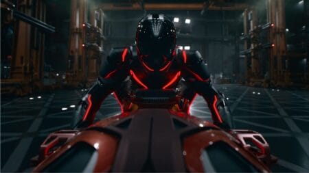 The rogue AI warrior program Ares rides his cool red lightcycle in the Disney blockbuster sequel TRON: ARES.