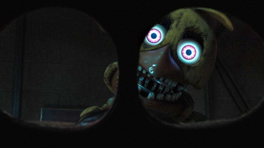 A POV shot of former security guard Mike Schmidt being confronted by the horrifying Withered Chica animatronic while wearing a fake Freddy mask in the movie sequel FIVE NIGHTS AT FREDDY'S 2. 