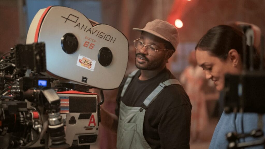 Director Ryan Coogler operates a large Panavision film camera on the set of his vampire horror blockbuster SINNERS produced by Warner Bros. 