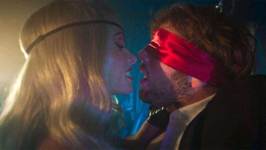 Olivia Wilde wears an eye patch as she gets intimate with Cooper Hoffman, who is tied up and blind folded, in Gregg Araki's indie comedy I WANT YOUR SEX.