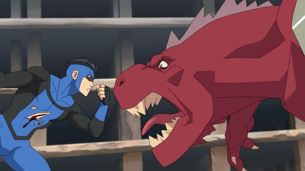 Mark Grayson in his blue and black superhero suit comes face to face in battle with the big red T-Rex looking alien monster Dinosaurus in INVINCIBLE Season 4 streaming only on Prime Video.