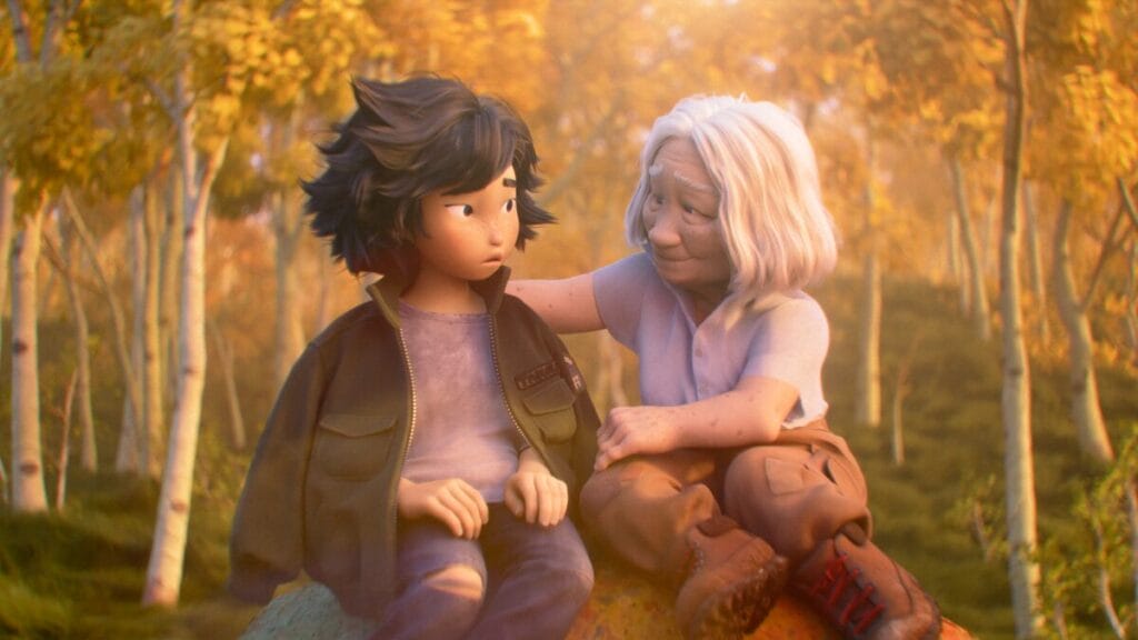 19-year-old Mabel Tanaka sits next to her Japanese grandmother on a large rock next to a beautiful pond in Pixar's original animated film HOPPERS. 