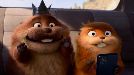 ‘Hoppers’ Review – A Highly Charming Breath of Fresh Air for Pixar A hilarious image of King George the beaver, voiced by Bobby Moynihan, looking happy and excited as he sits next to Mabel the robot beaver, voiced by Piper Curda, while she looks terrified in Pixar's HOPPERS.