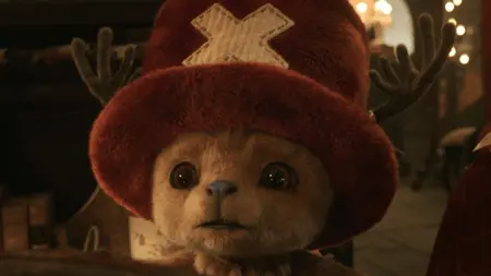 A close-up shot of the small reindeer doctor Tony Tony Chopper making his live-action debut while wearing his iconic fuzzy red top hat in ONE PIECE Season 2 on Netflix.