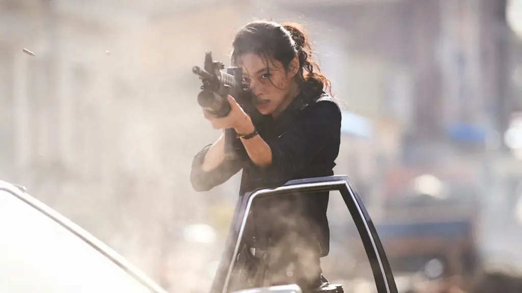 South Korean actress Jung Ho-yeon stars as rookie copy Sung-ae shooting at alien monsters in an epic shot from Na Hong-jin's HOPE.