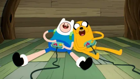 Finn and Jake play video games together in the new animation style of the prequel series ADVENTURE TIME: SIDE QUESTS.