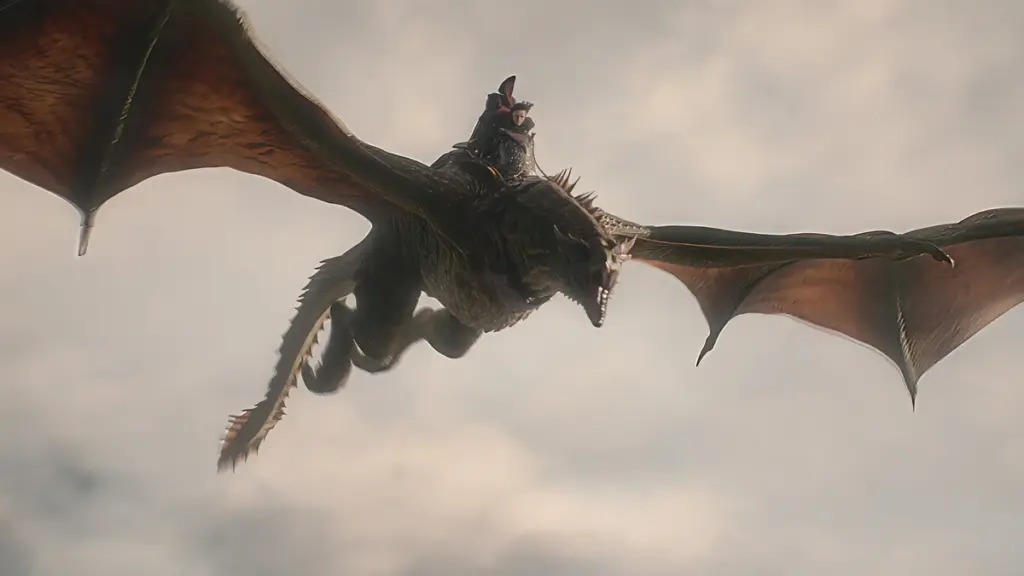Jace Velaryon rides his loyal dragon Sunfyre high in the sky in HOUSE OF THE DRAGON Season 3 on HBO.