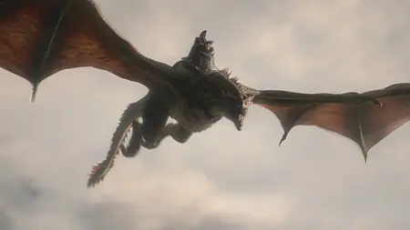 Jace Velaryon rides his loyal dragon Sunfyre high in the sky in HOUSE OF THE DRAGON Season 3 on HBO.