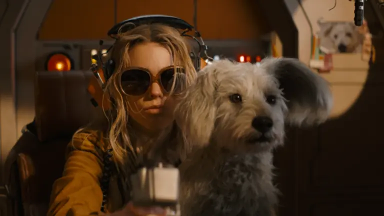 Milly Alcock stars as Kara Zor-El riding an alien ship with her cute and loyal white dog Krypto in SUPERGIRL.