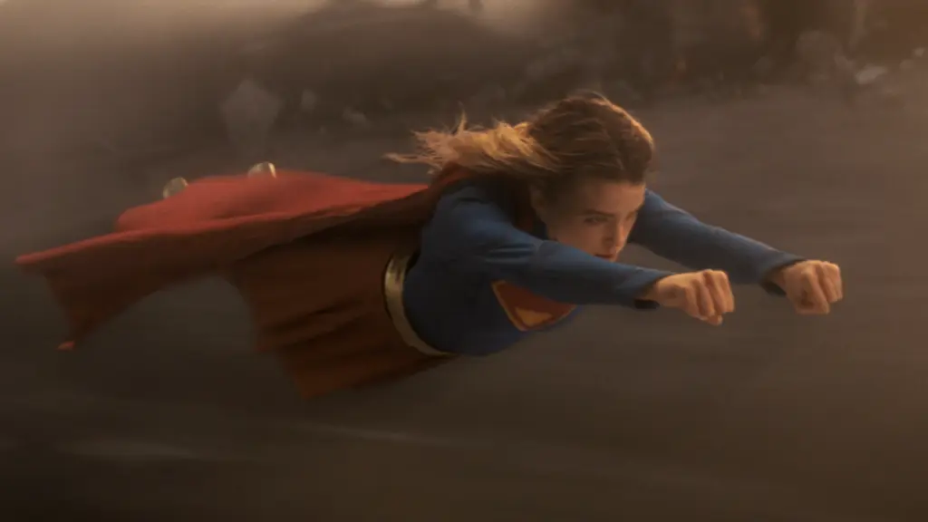 Milly Alcock stars as Supergirl flying at top speed across the sky on an alien planet in the 2026 SUPERGIRL movie.
