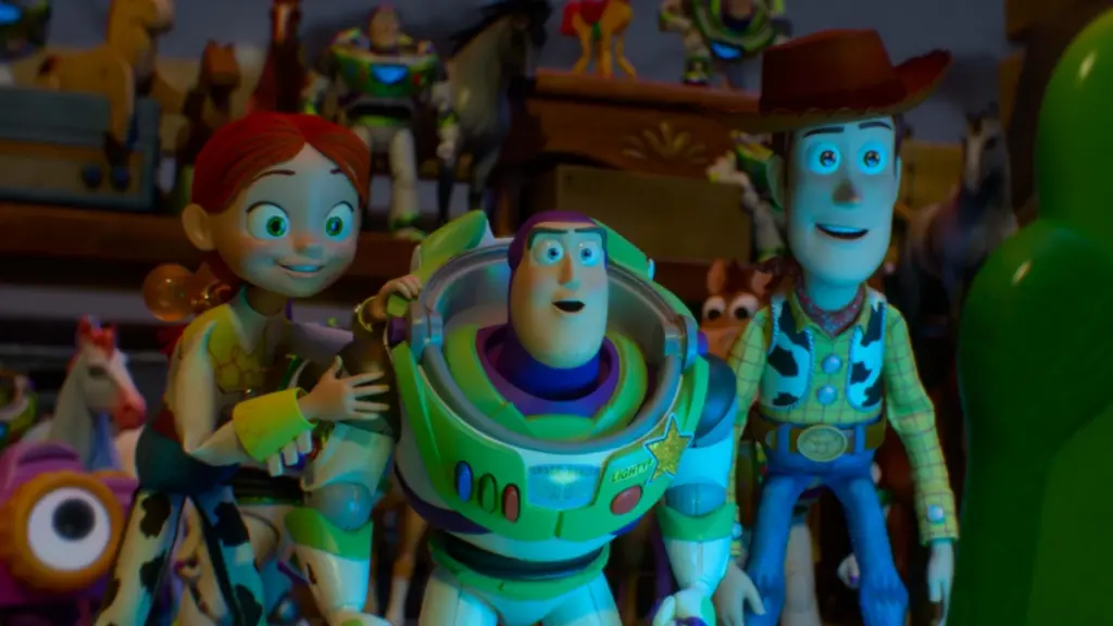 Jessie, Buzz Lightyear, and Woody look stunned with huge smiles as they stare into Lilypad's huge digital screen in TOY STORY 5.