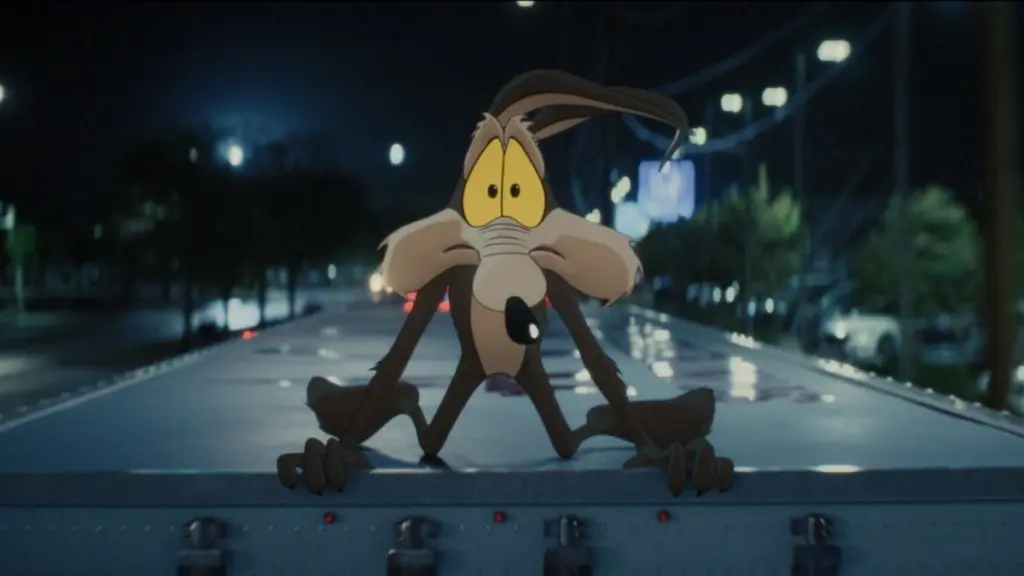 Wile E. Coyote makes a hilariously terrified face as he hangs onto the top of a speeding truck in the live-action/animated hybrid comedy COYOTE VS. ACME.