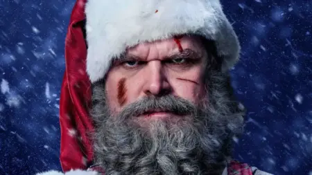 Violent Night 2: Director Tommy Wirkola Talks Going Bigger and Bloodier (EXCLUSIVE) David Harbour as Santa Claus with bruises and a mean look on his face on the official poster for the sequel VIOLENT NIGHT 2.