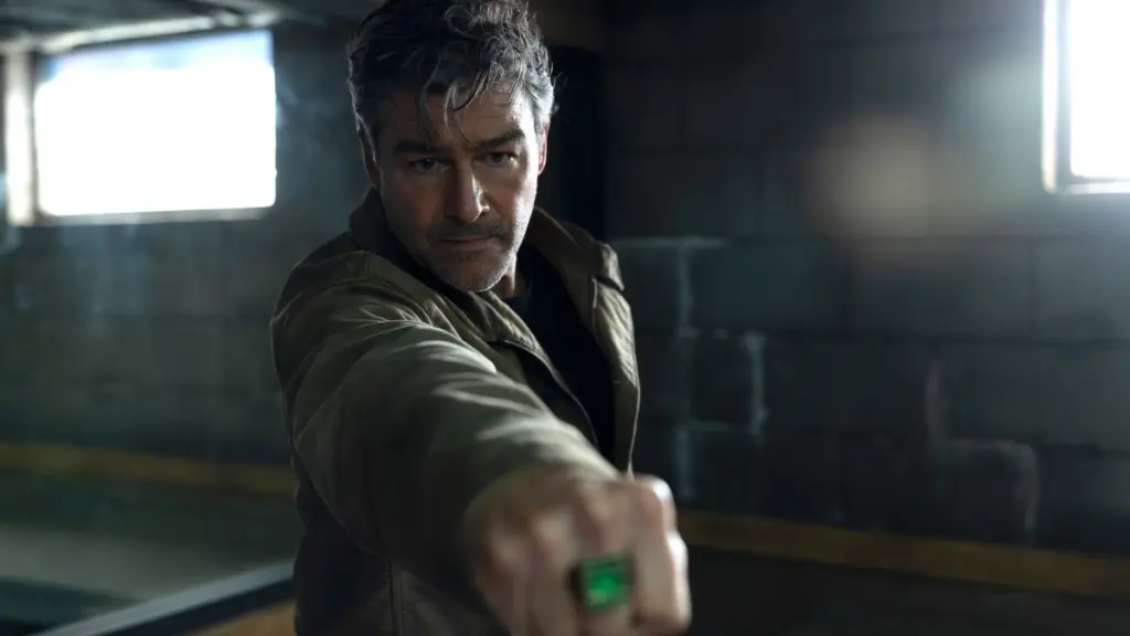 Hal Jordan raises his fist with the Green Lantern ring towards the camera in HBO's LANTERNS show.