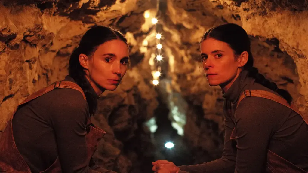 Real-life sisters Rooney and Kate Mara star as the inseparable twins Joan and Jean Holbrooke sitting together in a large underground tunnel in the film BUCKING FASTARD.