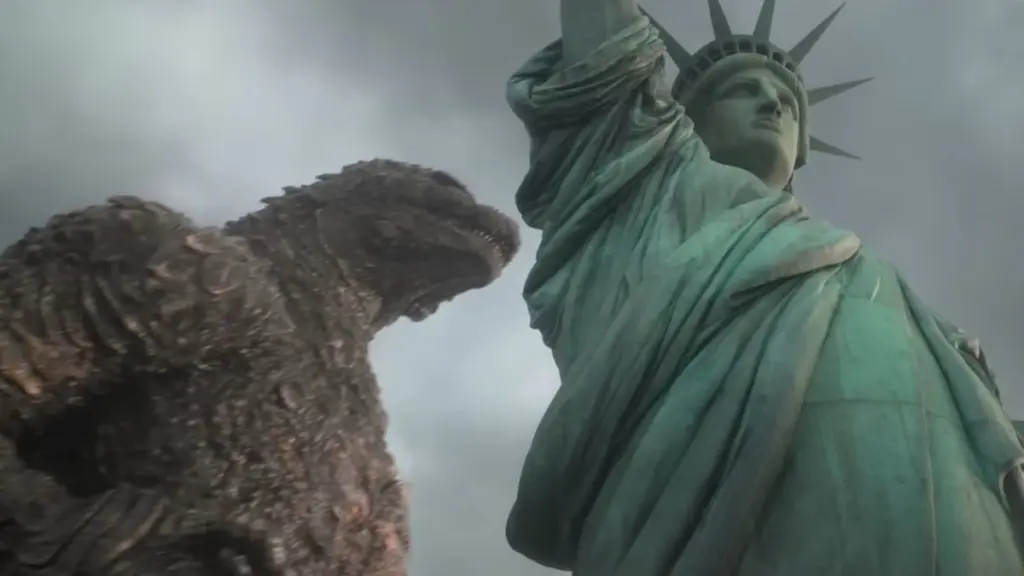 An epic shot of Godzilla walking next to the iconic Statue of Liberty in New York in Takashi Yamazaki's GODZILLA MINUS ZERO. 