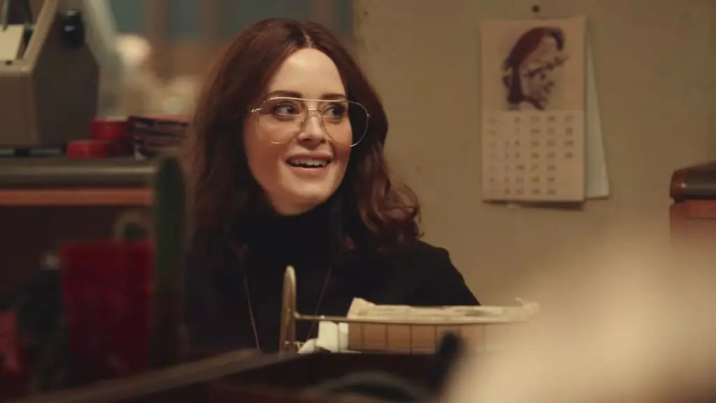Claire Foy stars as reporter Jules Davies sitting at her desk in The Sun tabloid newsroom in the movie INK.