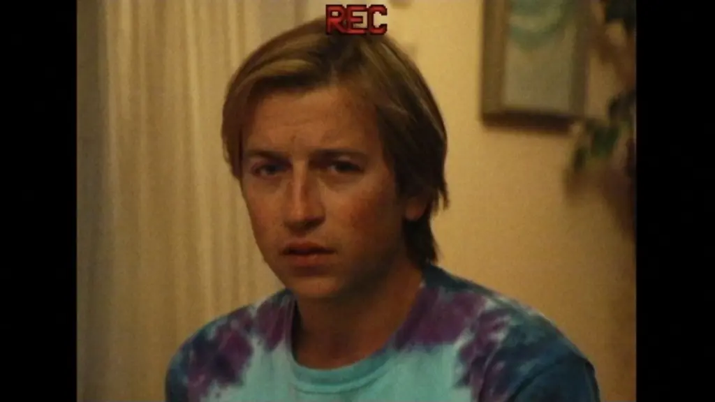 A VHS camcorder shot of Skyler Gisondo as human decoy Dan Plumb in PRIMETIME, the A24 movie about To Catch a Predator.