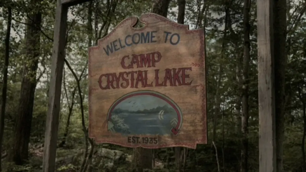 The iconic wooden sign welcoming guests to Camp Crystal Lake in the Friday the 13 prequel series on Peacock. 
