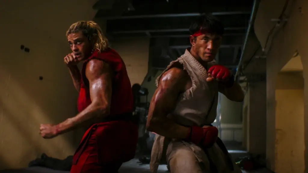 ‘Street Fighter’ Review – A Messy Yet Oddly Compelling Video Game Adaptation Noah Centineo and Andrew Koji strike a cool fighting pose as Ken and Ryu in their iconic game costumes in the live-action STREET FIGHTER movie.