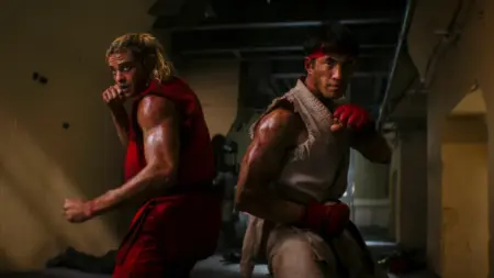 ‘Street Fighter’ Review – A Messy Yet Oddly Compelling Video Game Adaptation Noah Centineo and Andrew Koji strike a cool fighting pose as Ken and Ryu in their iconic game costumes in the live-action STREET FIGHTER movie.